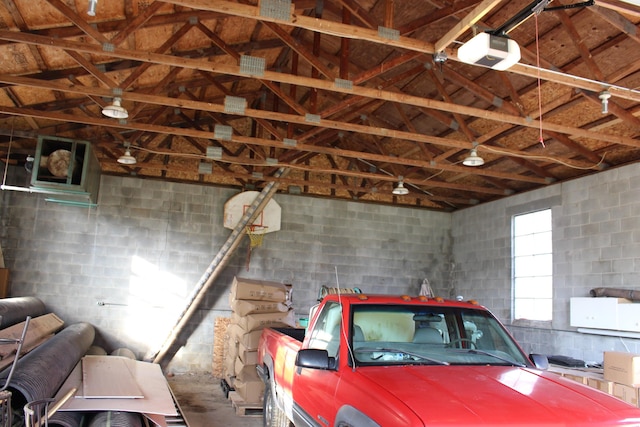 9370 Moon Rd, Saline, MI 48176 - garage featuring concrete block wall and a garage door opener