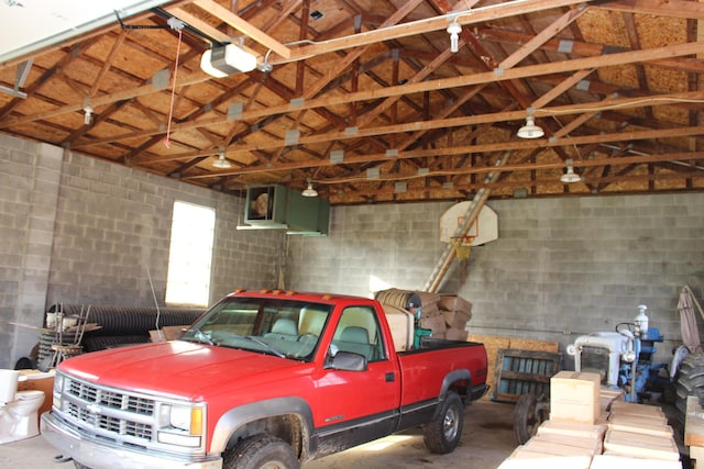 9370 Moon Rd, Saline, MI 48176 - garage with a garage door opener and concrete block wall