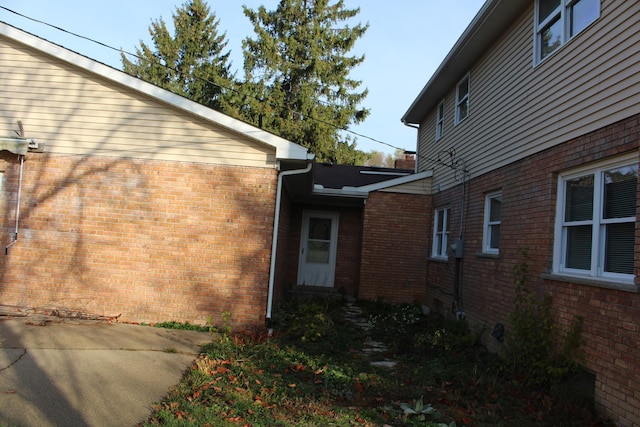 9370 Moon Rd, Saline, MI 48176 - view of home's exterior featuring brick siding