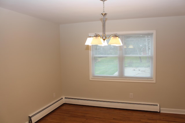 9370 Moon Rd, Saline, MI 48176 - spare room with a chandelier, dark wood-style flooring, baseboards, and a baseboard radiator