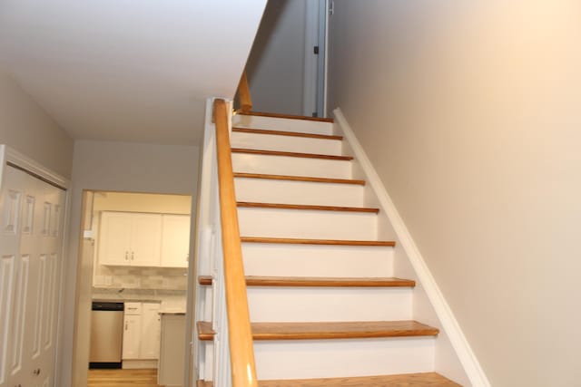 stairway with wood-type flooring