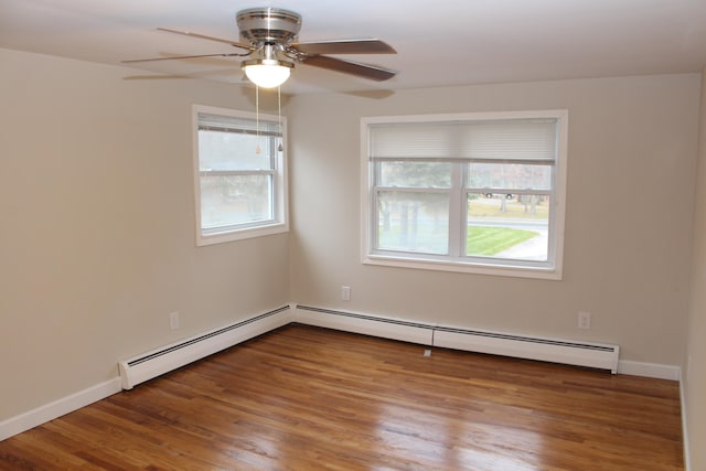 unfurnished room with ceiling fan, a baseboard radiator, and hardwood / wood-style flooring