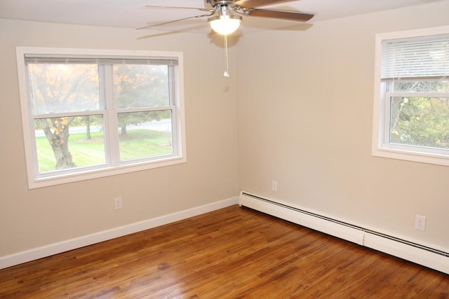 empty room with ceiling fan, a baseboard radiator, and hardwood / wood-style flooring