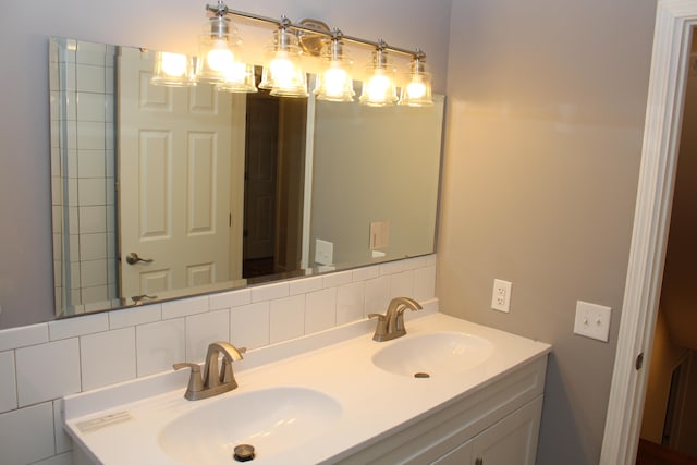 bathroom with vanity and backsplash