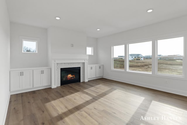 unfurnished living room featuring light hardwood / wood-style floors