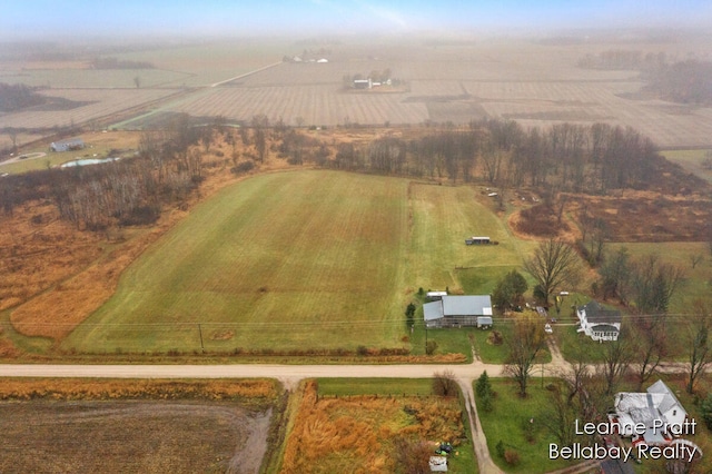 birds eye view of property with a rural view