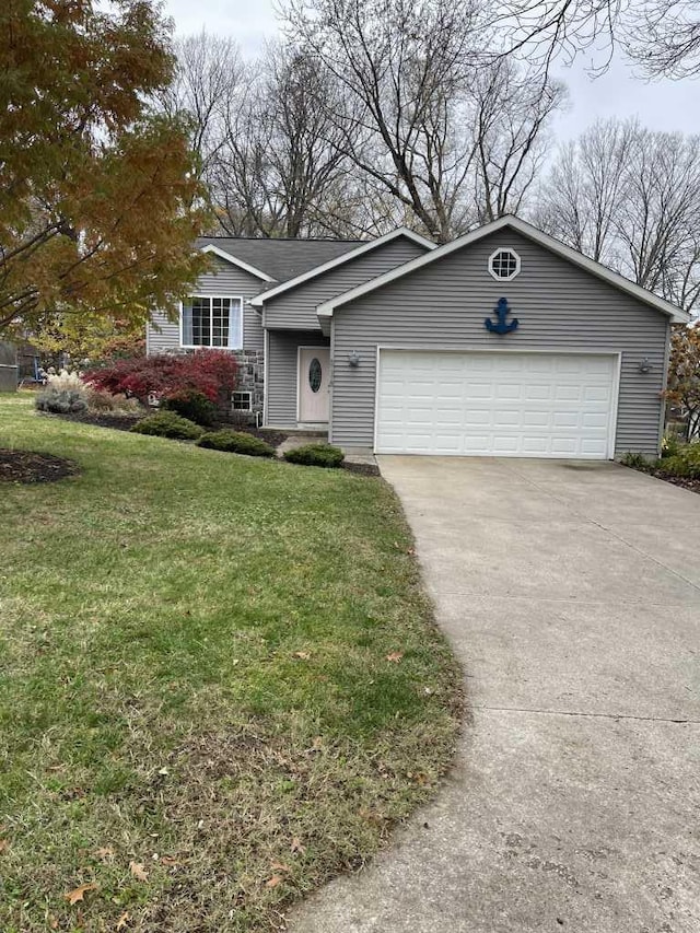 ranch-style house with a front yard and a garage