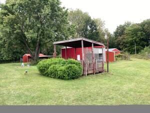 view of outbuilding with a yard