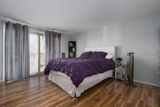 bedroom with dark hardwood / wood-style flooring