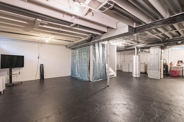 basement with washing machine and dryer