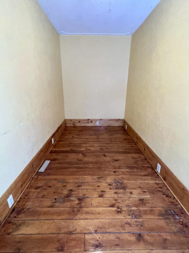 empty room with dark hardwood / wood-style floors