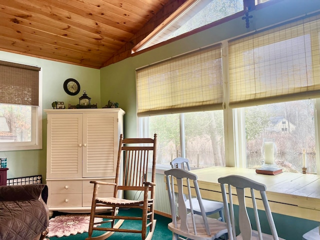 living area with plenty of natural light, wood ceiling, and vaulted ceiling