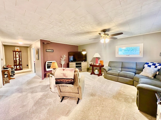 living room featuring heating unit, ceiling fan, and light colored carpet