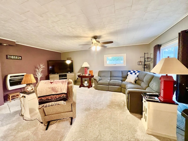 living room with ceiling fan, light carpet, and heating unit