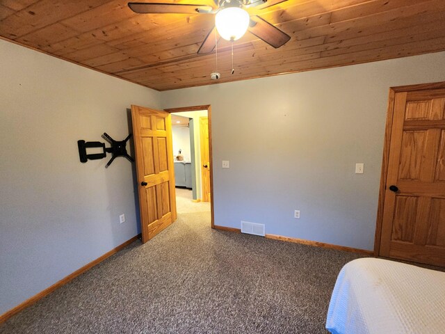 bedroom featuring carpet flooring, ceiling fan, and wood ceiling