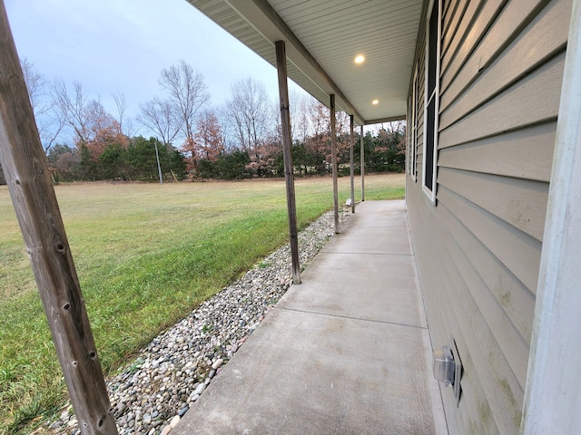 view of yard featuring covered porch