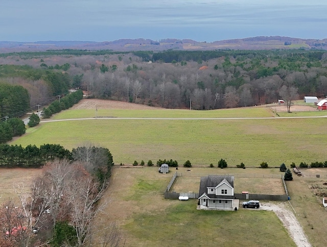 drone / aerial view featuring a mountain view and a rural view