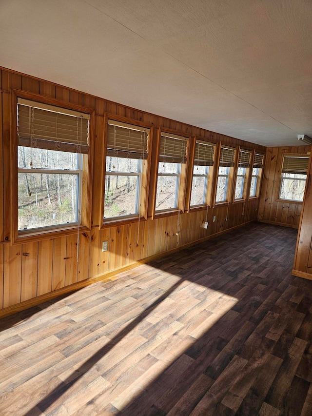 unfurnished sunroom featuring a wealth of natural light