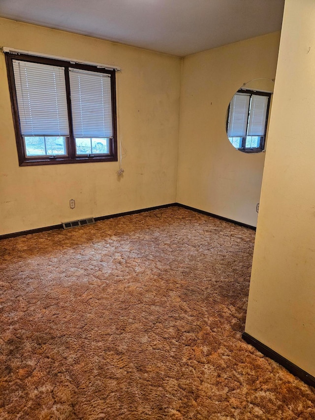 empty room featuring carpet flooring