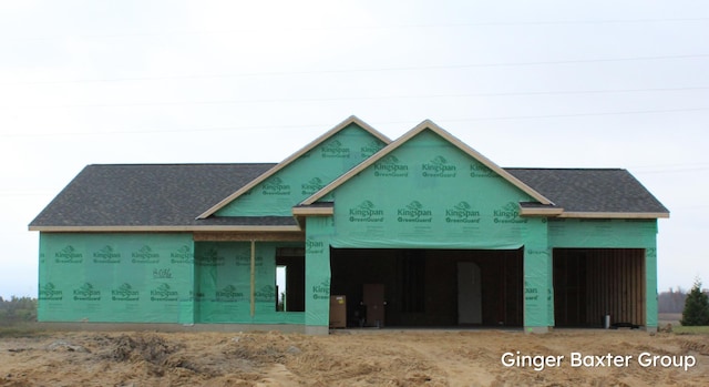 property in mid-construction with a garage