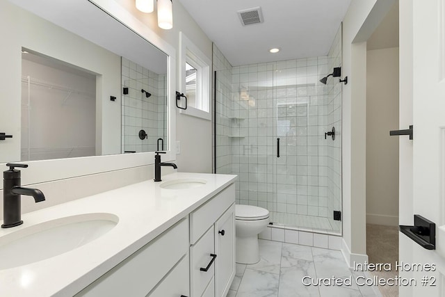 full bath featuring a stall shower, marble finish floor, visible vents, and a sink