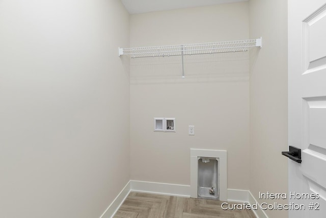 laundry room with laundry area, baseboards, and washer hookup