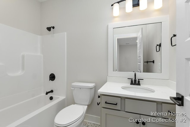 bathroom featuring  shower combination, vanity, and toilet