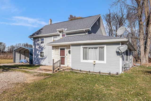 view of front of home featuring a carport and a front yard