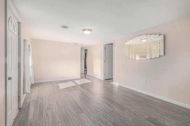 empty room featuring hardwood / wood-style flooring