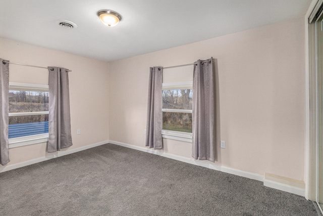 empty room with carpet flooring