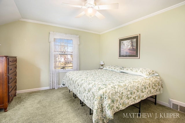 carpeted bedroom with vaulted ceiling, ceiling fan, and ornamental molding