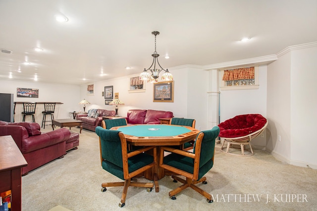 recreation room with crown molding, light carpet, and a notable chandelier