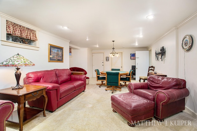 living room featuring carpet flooring, ornamental molding, and an inviting chandelier