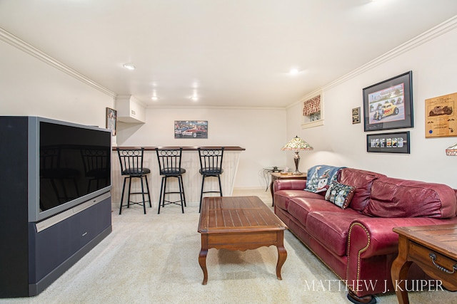 carpeted living room featuring bar area and ornamental molding