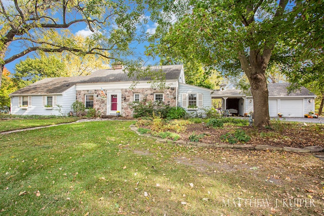 view of front facade with a front yard and a garage