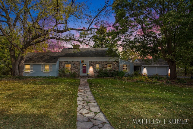 ranch-style house with a lawn