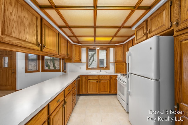 kitchen featuring light tile patterned floors, white appliances, coffered ceiling, and sink