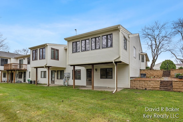 view of front of property with central AC, a patio area, and a front lawn