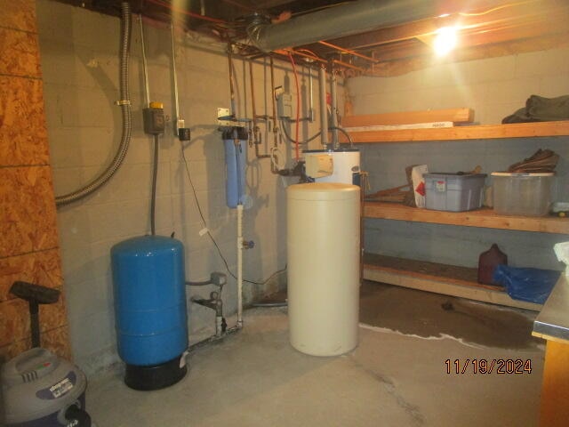 utility room featuring electric water heater