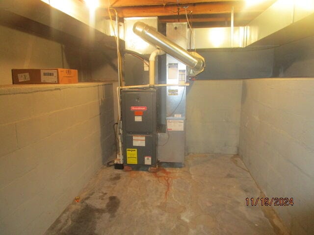 utility room with heating unit