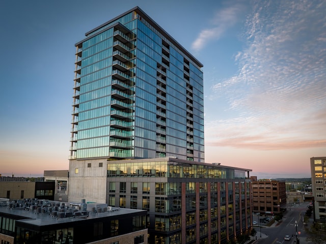 view of outdoor building at dusk