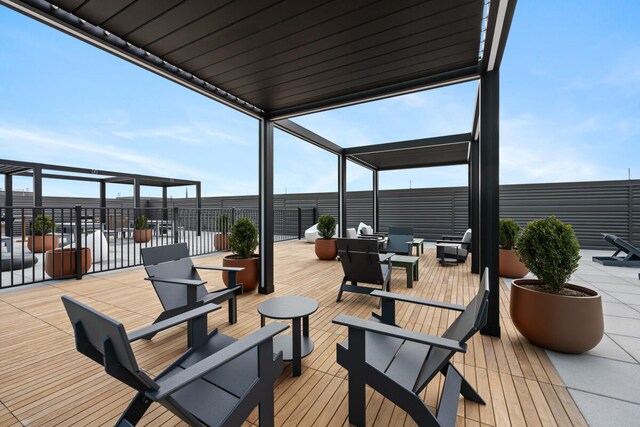 wooden terrace featuring an outdoor hangout area