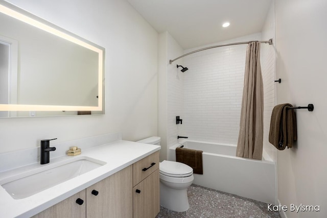 bathroom featuring recessed lighting, shower / tub combo, toilet, and vanity