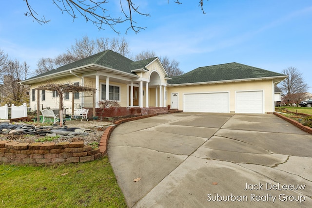 view of front of home with covered porch and a garage