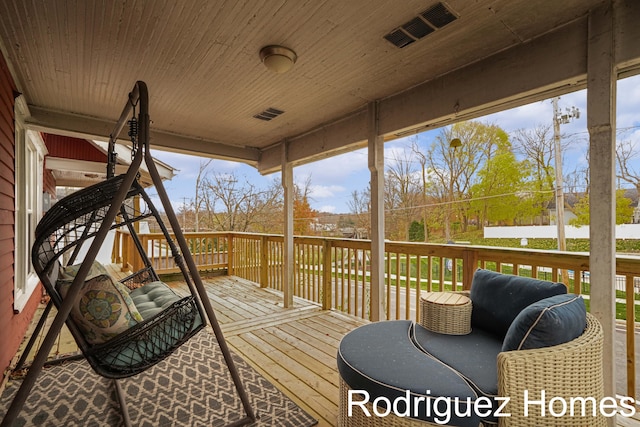 wooden deck with visible vents