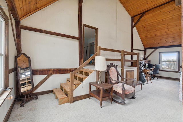 staircase featuring carpet flooring, wooden ceiling, and high vaulted ceiling