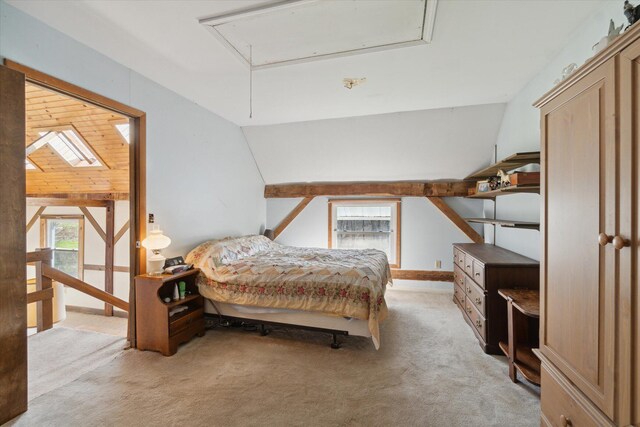 carpeted bedroom with vaulted ceiling