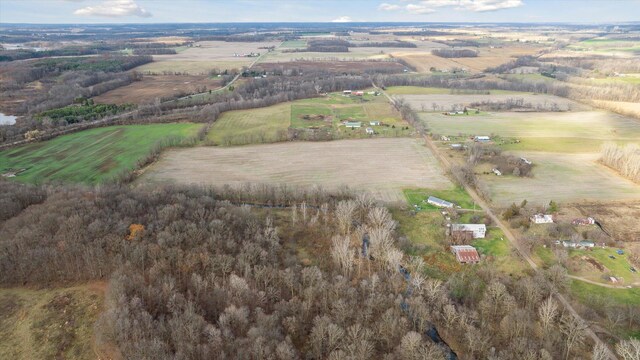 birds eye view of property featuring a rural view