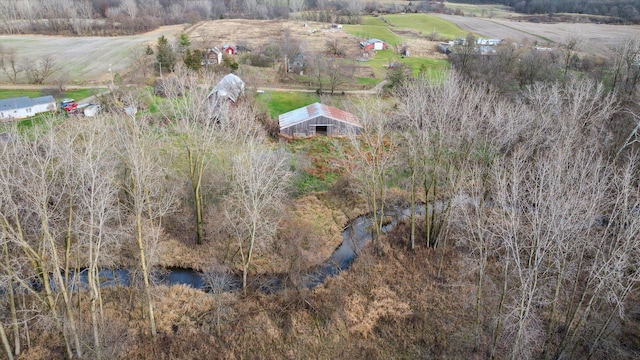 drone / aerial view featuring a water view and a rural view