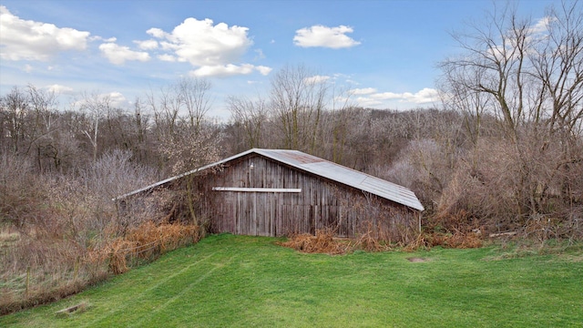 view of outdoor structure with a lawn